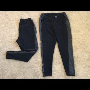 2 pairs Torrid black leggings with pleather stripe